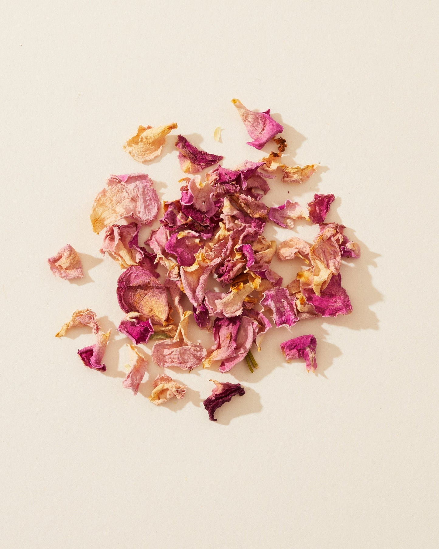Dried rosebuds and pink petals