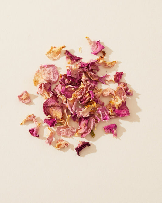 Dried rosebuds and pink petals